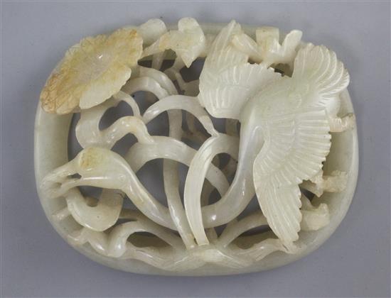 A Chinese pale celadon and russet jade plaque, Jin - Yuan dynasty, 8.4cm, slight faults